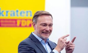 Protester throws cake at ex-German Finance Minister Christian Lindner